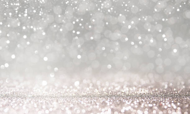 istock Christmas light background.  Holiday glowing backdrop. Defocused Background With Blinking Stars. Blurred Bokeh. 1011505254