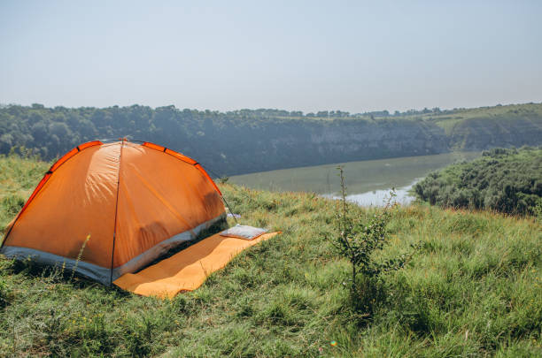 istock rest and overnight wild tent river canyon 1011505620