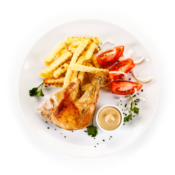 istock Fried chicken legs with French fries 1011506052