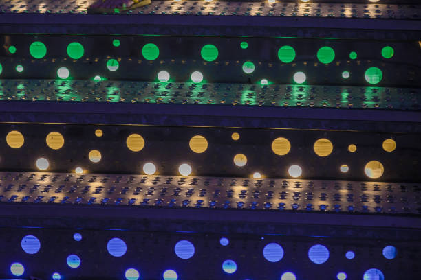 Bright colored lamps on carousels at night
