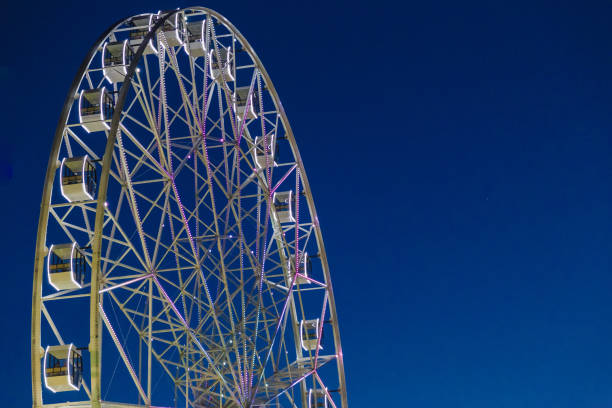 istock Very large Ferris wheel against the blue sky 1011514644