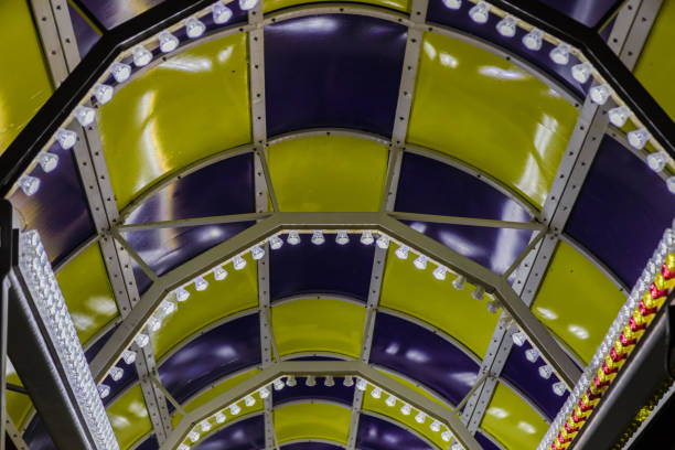 istock Bright colored lamps on carousels at night 1011514798