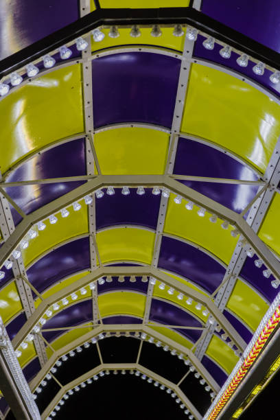 istock Bright colored lamps on carousels at night 1011514878