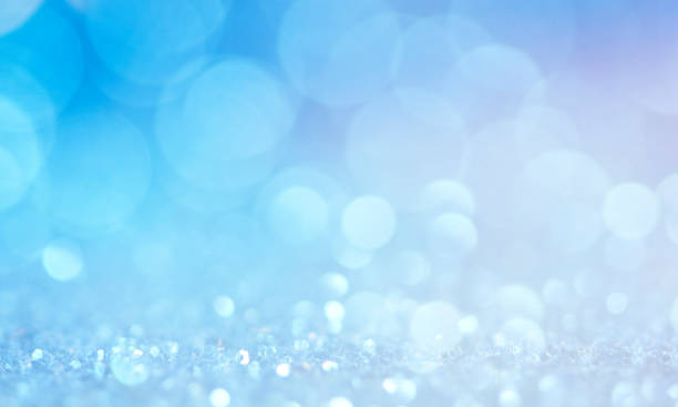 istock Christmas light background.  Holiday glowing backdrop. Defocused Background With Blinking Stars. Blurred Bokeh. 1011517950