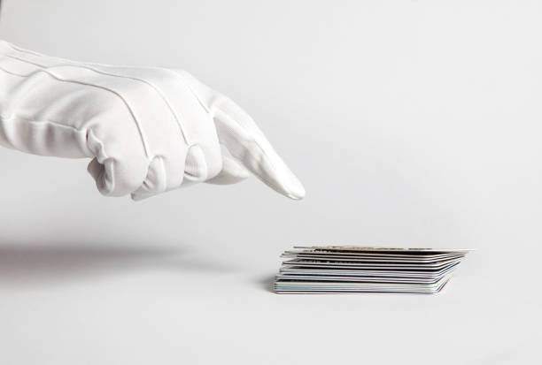 istock white glove holding a credit card 1011518054