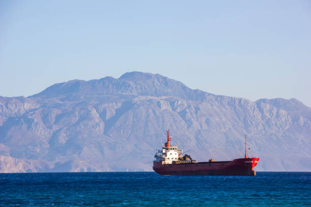 istock Cargo Ship Near Agios Nikolaos, Crete, Greece. 1011538992