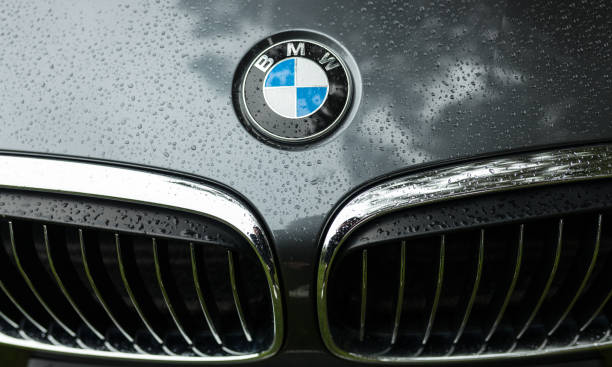Bmw motor company badge on the front from a black car. BMW is a German automobile, motorcycle and engine manufacturing company founded in 1916 Crozon, France - May 29th, 2018: Bmw motor company badge on the front from a black car. BMW is a German automobile, motorcycle and engine manufacturing company founded in 1916. bmw stock pictures, royalty-free photos & images