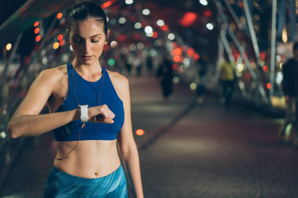 istock Sportswoman checking her smart watch 1011547428