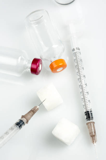 Syringes caps and bottles kits isolated on white
