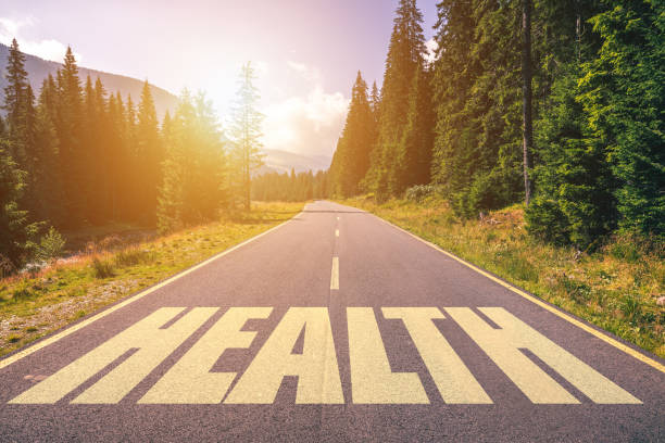 istock Work Health written on road in the mountains 1011559420