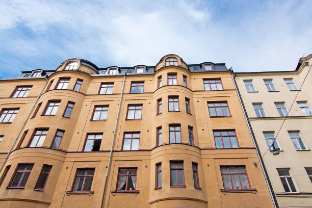 istock Vasastan typical century old buildings in yellow roughcast 1011564020