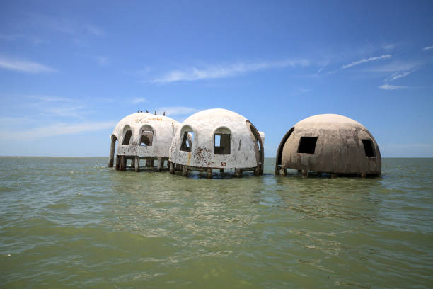 istock Blue sky over the Cape Romano dome house ruins 1011604978