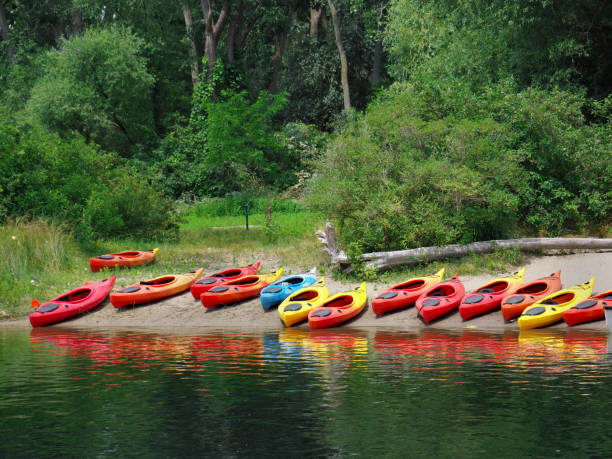 istock kayaks on beach for summer camp 1011604996