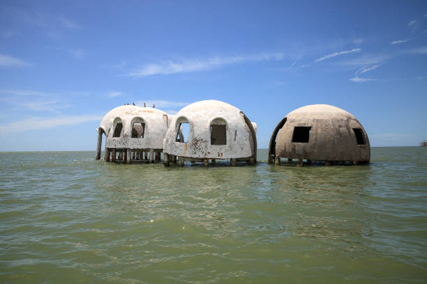 istock Blue sky over the Cape Romano dome house ruins 1011605302
