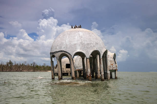 istock Blue sky over the Cape Romano dome house ruins 1011605702