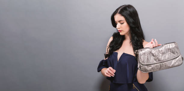 istock Fashionable woman on a solid background 1011605820