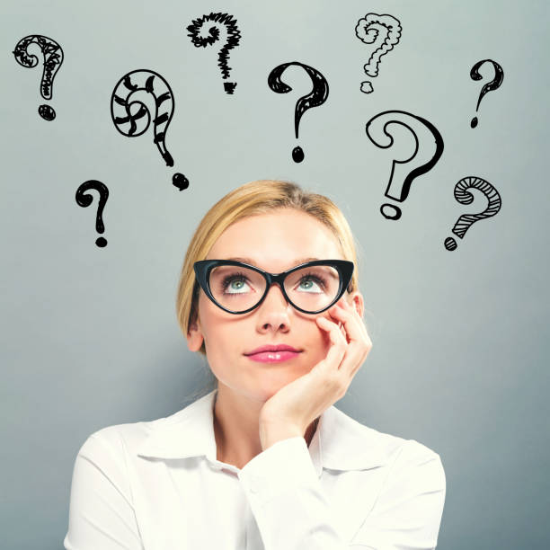 istock Question Marks with business woman 1011610208