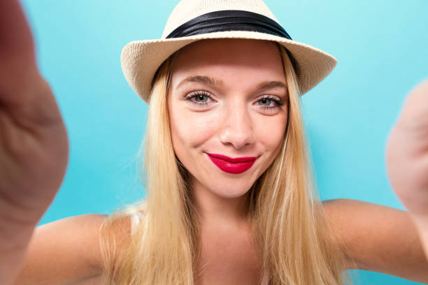 istock Young woman taking a selfie 1011610538