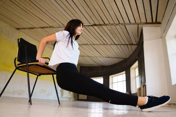 istock Back and arms workout without equipment in gym 1011610884