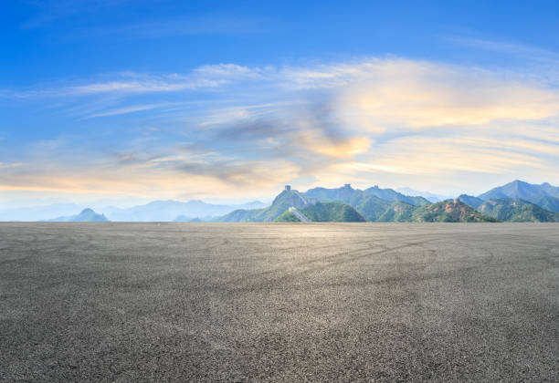istock Car drift asphalt square and great wall with mountains 1011613976