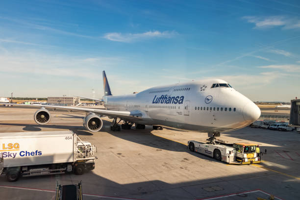 Frankfurt: An airplane tractor is pushing back a Boeing 747 of Lufthansa at the Frankfurt main Airport.