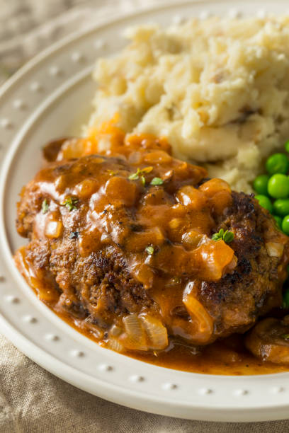 homemade savory salisbury steaks - salisbury steak imagens e fotografias de stock