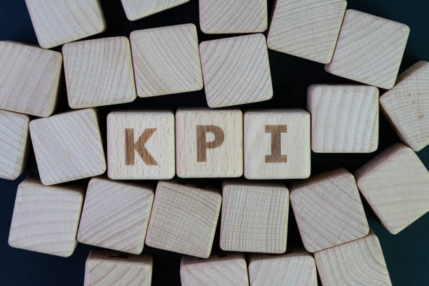istock KPI, Key Point Indicator business success measurement target and goal management concept, cube wooden block with alphabet building the word KPI on blackboard 1011619090