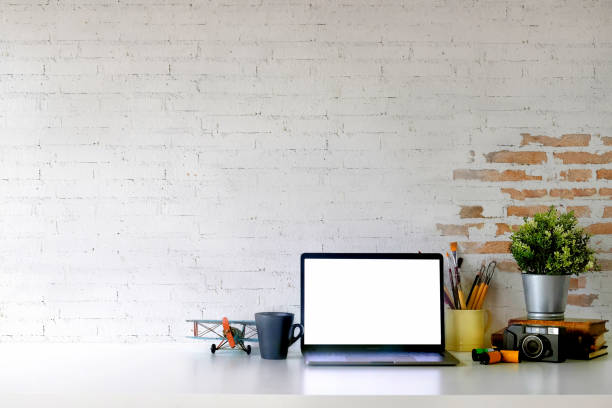 istock Loft workspace with mockup laptop on desk 1011626344
