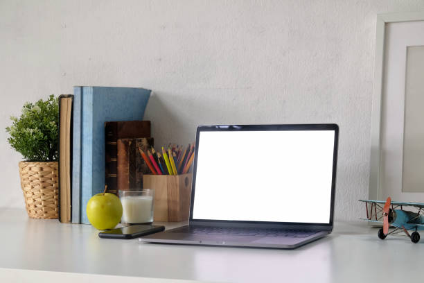 istock Loft workspace with laptop and minimal accessory on white  table. Workplace and copy space 1011626346