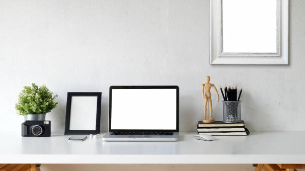 istock Desk, workspace with laptop and office supplies. 1011626440
