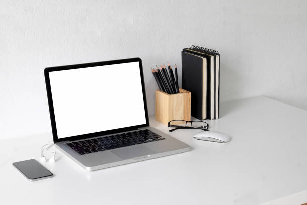 istock Business image, Blank screen laptop and supplies. 1011626452