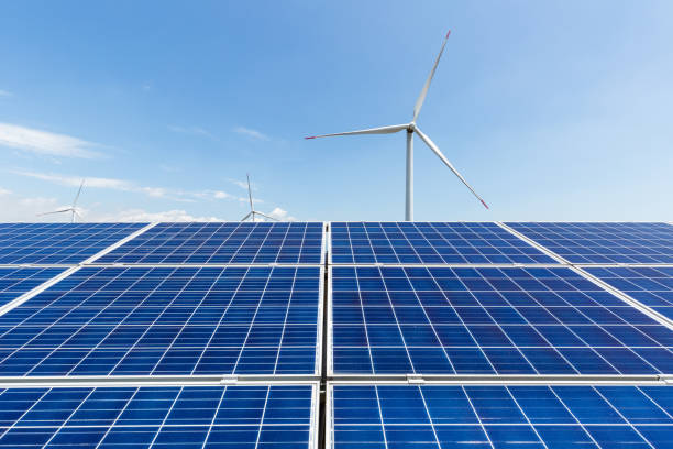 istock solar panel and wind turbine against a clear sky 1011626460