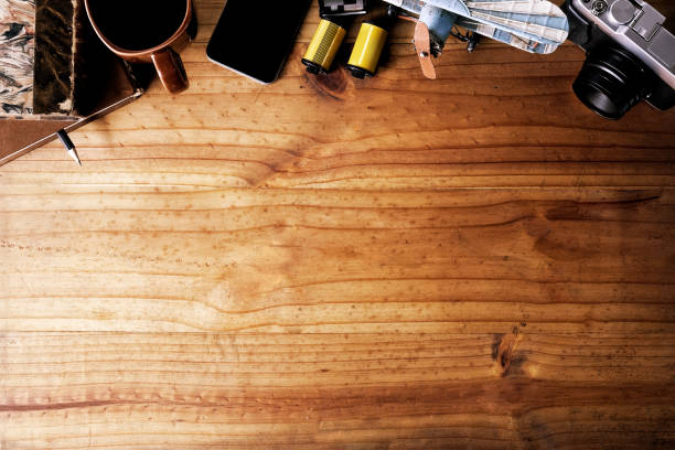 istock Workspace of creative photographer with tools and copy space on wood desk. 1011626466