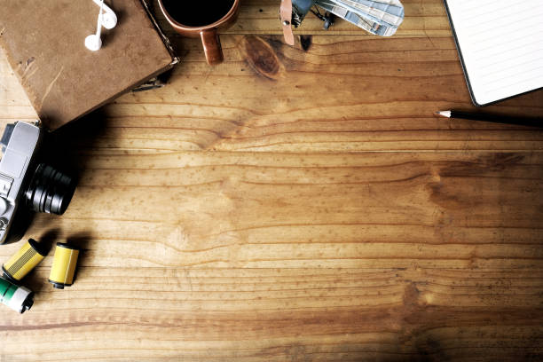 istock Workspace of creative photographer with tools and copy space on wood desk. 1011626518