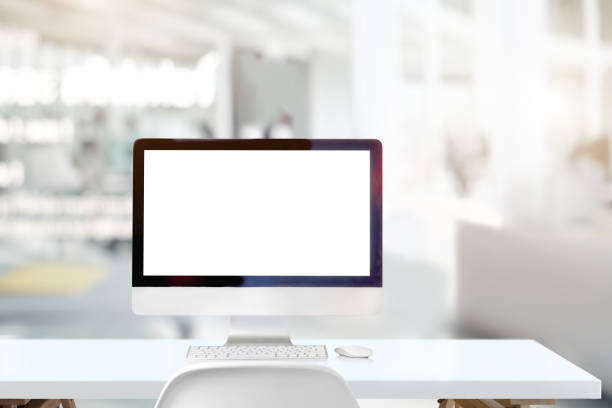 istock Workplace with mockup desktop computer on white wooden desk in office 1011626670