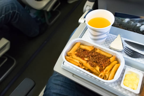 istock In flight meal - food flying in economy class. 1011626892