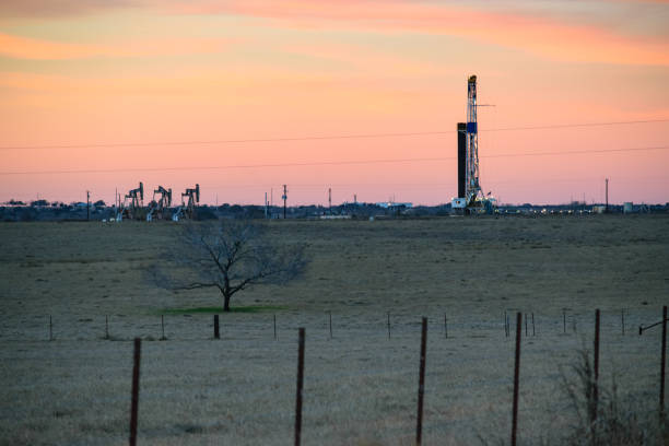 American Oil Wells Texas Wells in the Permian being Drilled and Fracked wellhead stock pictures, royalty-free photos & images