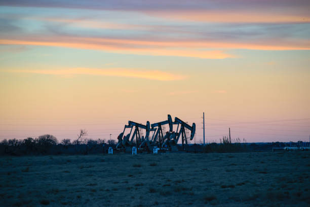 American Oil Wells Texas Wells in the Permian being Drilled and Fracked wellhead stock pictures, royalty-free photos & images