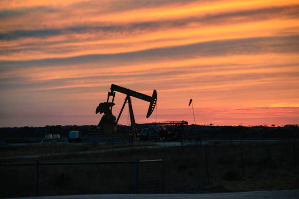 American Oil Wells Texas Wells in the Permian being Drilled and Fracked wellhead stock pictures, royalty-free photos & images