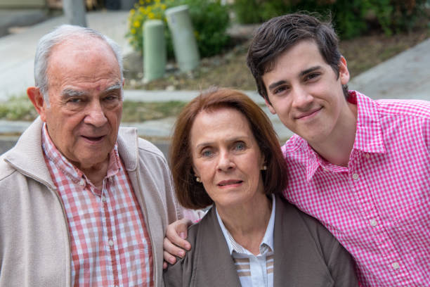 istock young man posing with his grand parents 1011634732