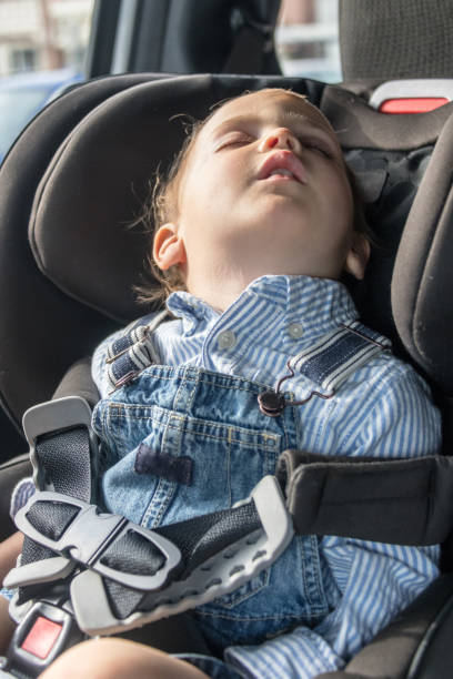 istock Toddler sitting in his car seat sleeping 1011636838