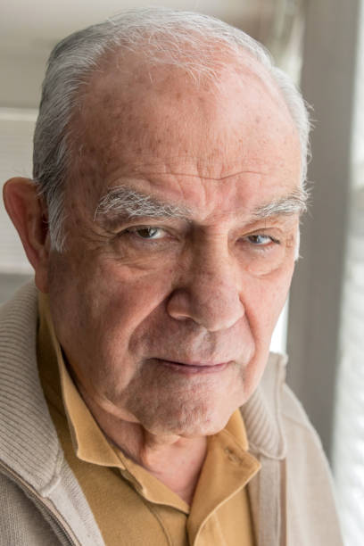 istock Senior man posing near a window 1011640192