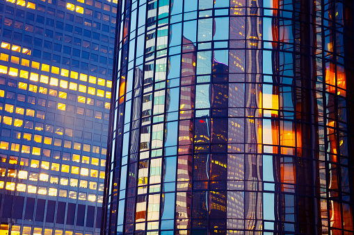 building exterior. Close up on office building at night with reflection