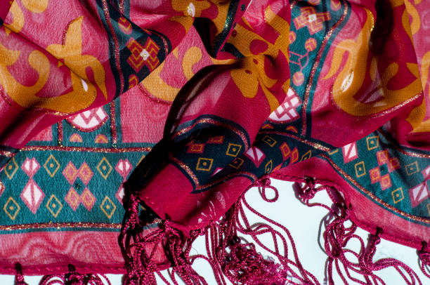 istock Background texture, pattern. Red maroon fabric. Click on your local heritage with this red, bard and yellow striped silk. This patterned fabric will decorate your design. your work will be exclusive 1011648342