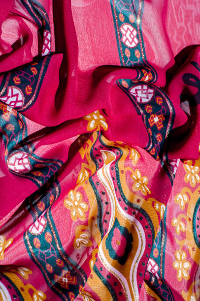 istock Background texture, pattern. Red maroon fabric. Click on your local heritage with this red, bard and yellow striped silk. This patterned fabric will decorate your design. your work will be exclusive 1011648438