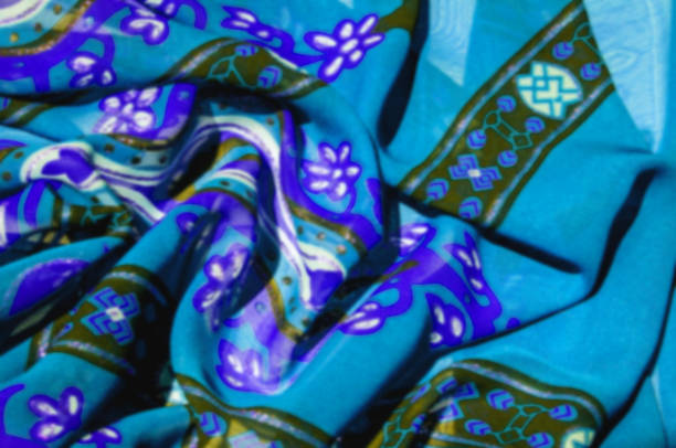 istock Background texture Blue silk fabric with a pattern. this light silk braided can be turned into your design. With the help of several segments from this print, you can get precious samples of your work 1011648750