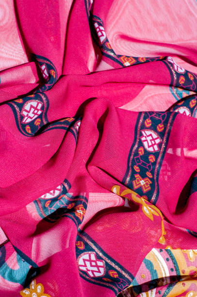 istock Background texture, pattern. Red maroon fabric. Click on your local heritage with this red, bard and yellow striped silk. This patterned fabric will decorate your design. your work will be exclusive 1011649972