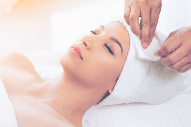 istock Relaxed young woman lying on spa bed for massage. 1011654314