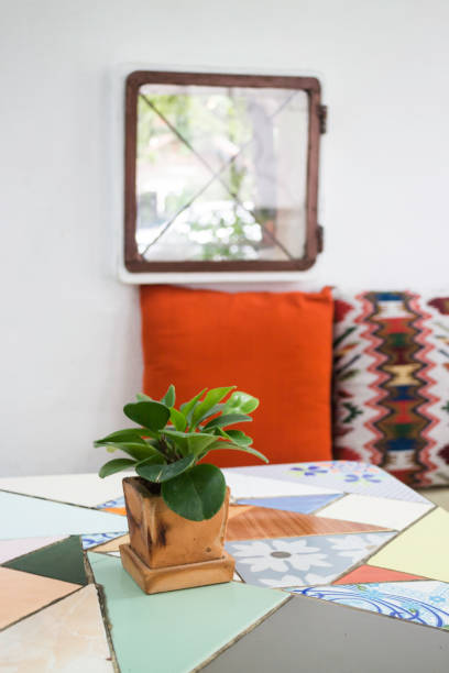istock Green plant pot on the table 1011659986