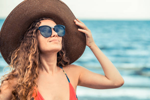 istock Happy young woman at beach in summer vacation. 1011667976